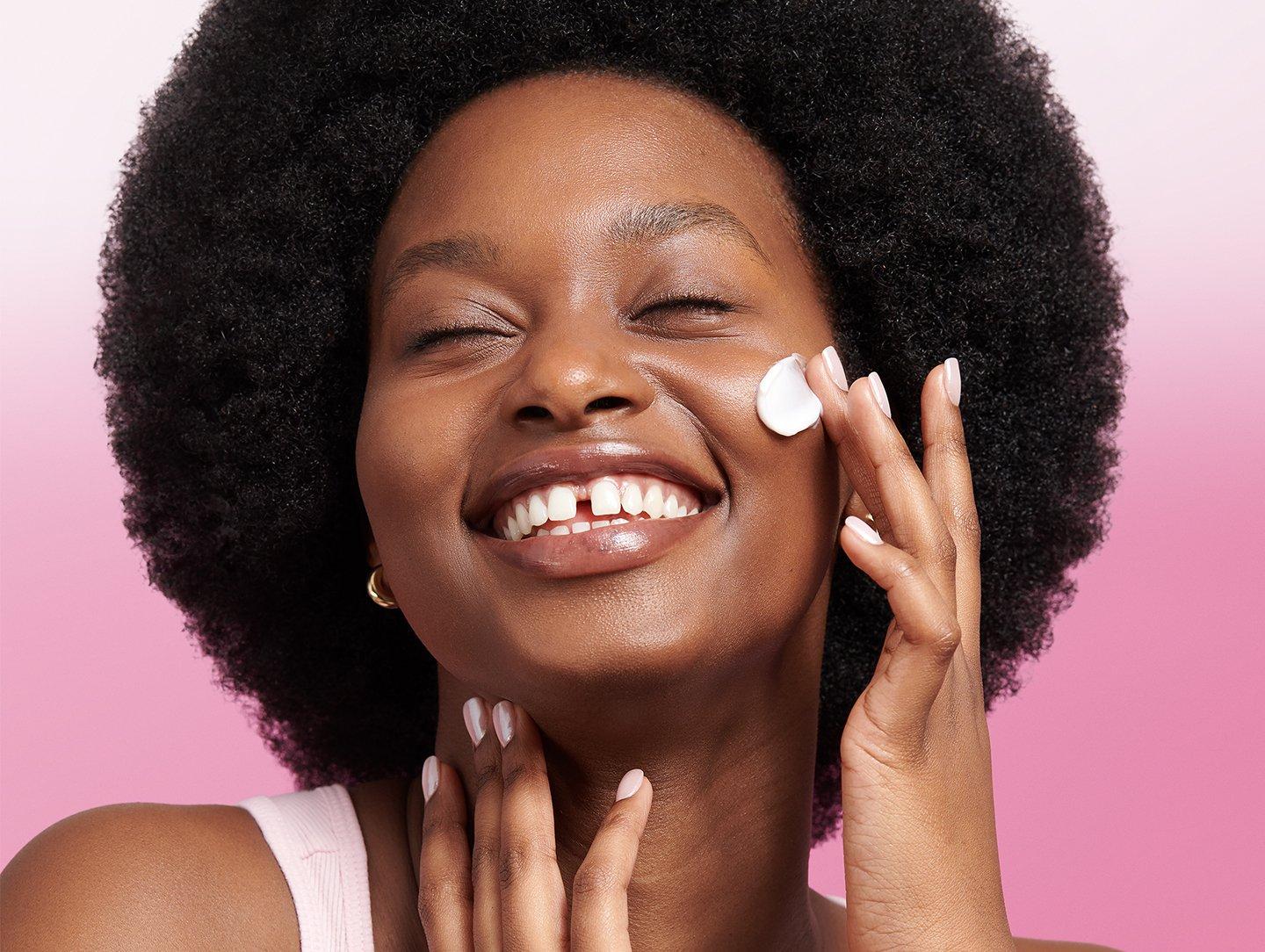 Model applying Vitamin E cream