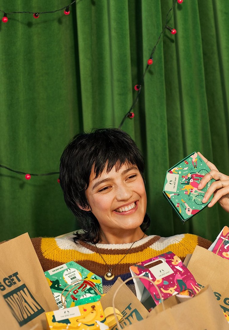 Person surrounded by gifts