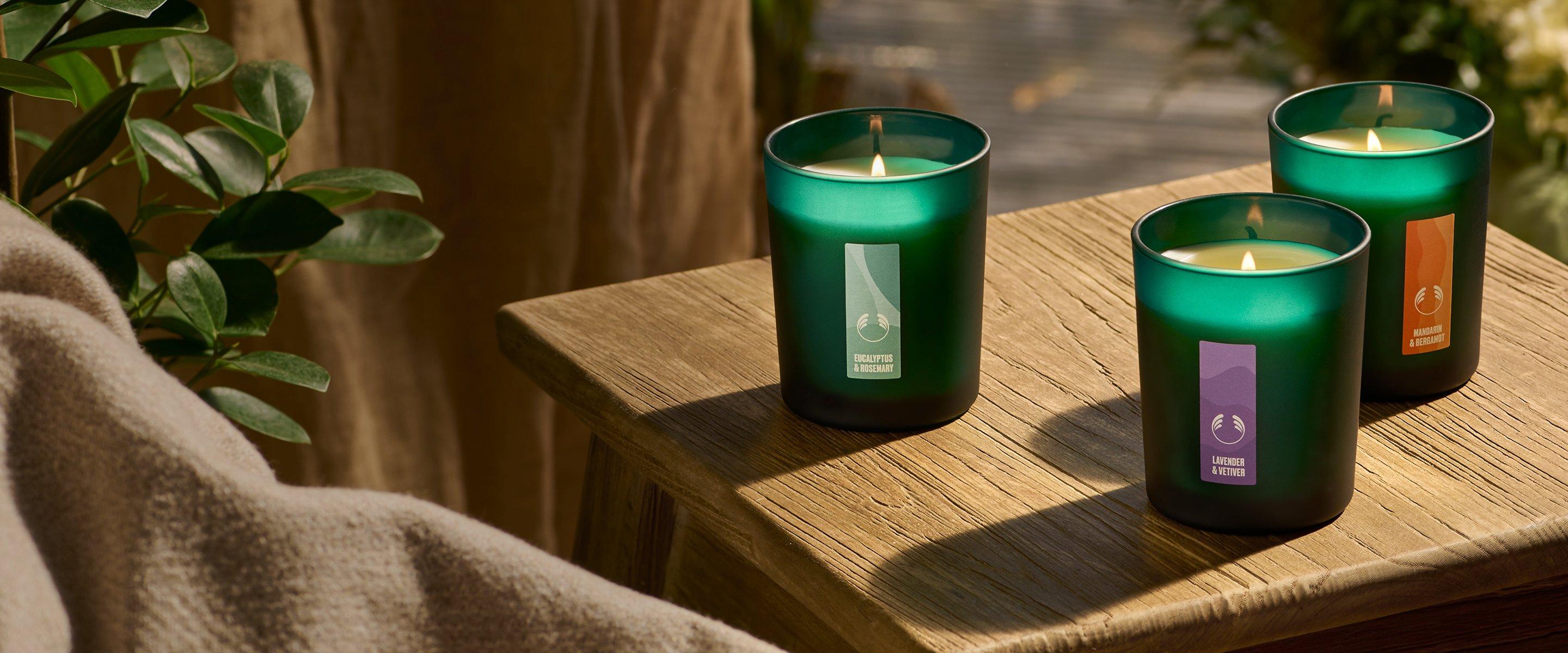 Image of three green candles on table