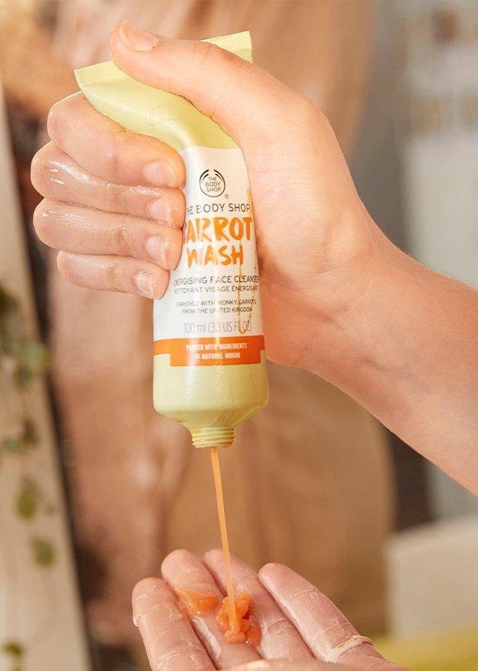 Carrot Washing being applied to model's hand