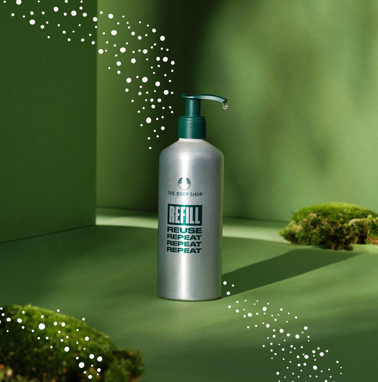 Refill bottle on green Christmas background