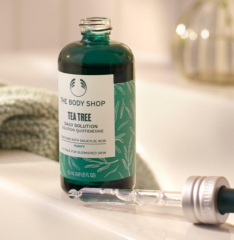 Bottle of Tea Tree Daily Solution in bathroom