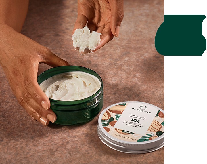 Model scooping Body Butter from tub Model scooping Body Butter from tub