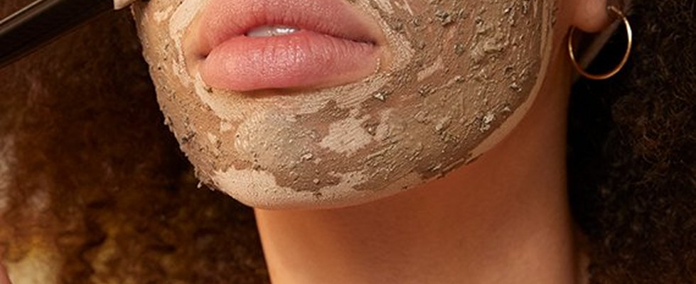 Model applying face mask Model applying face mask