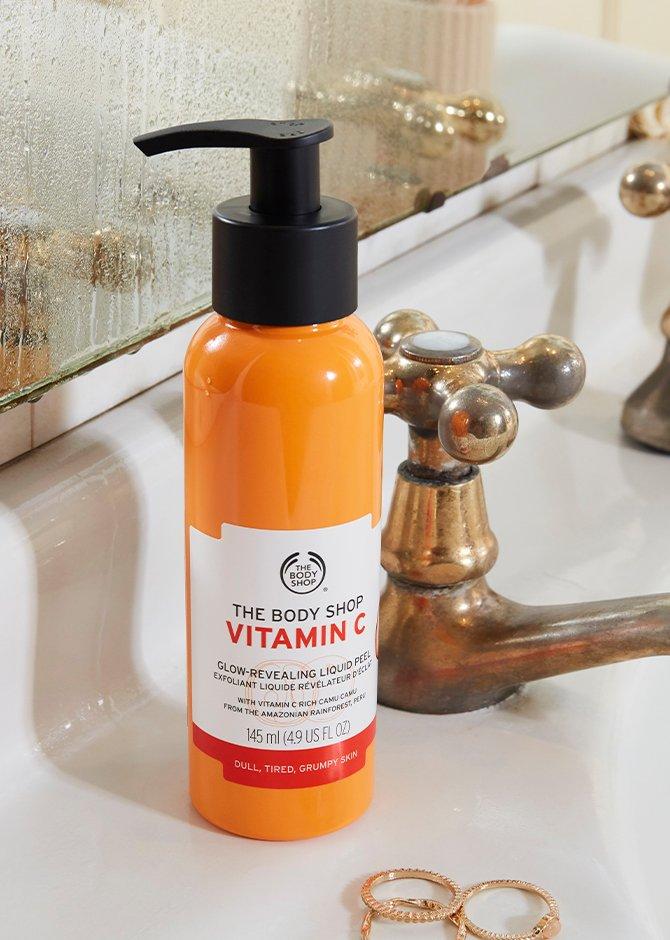 Vitamin C Liquid Peel on white bathroom sink