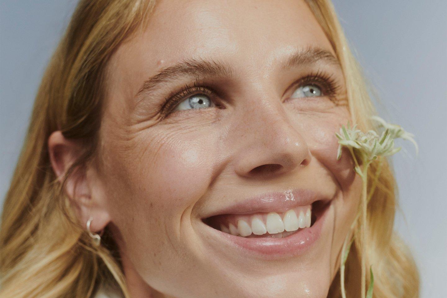 Model smelling Edelweiss flower