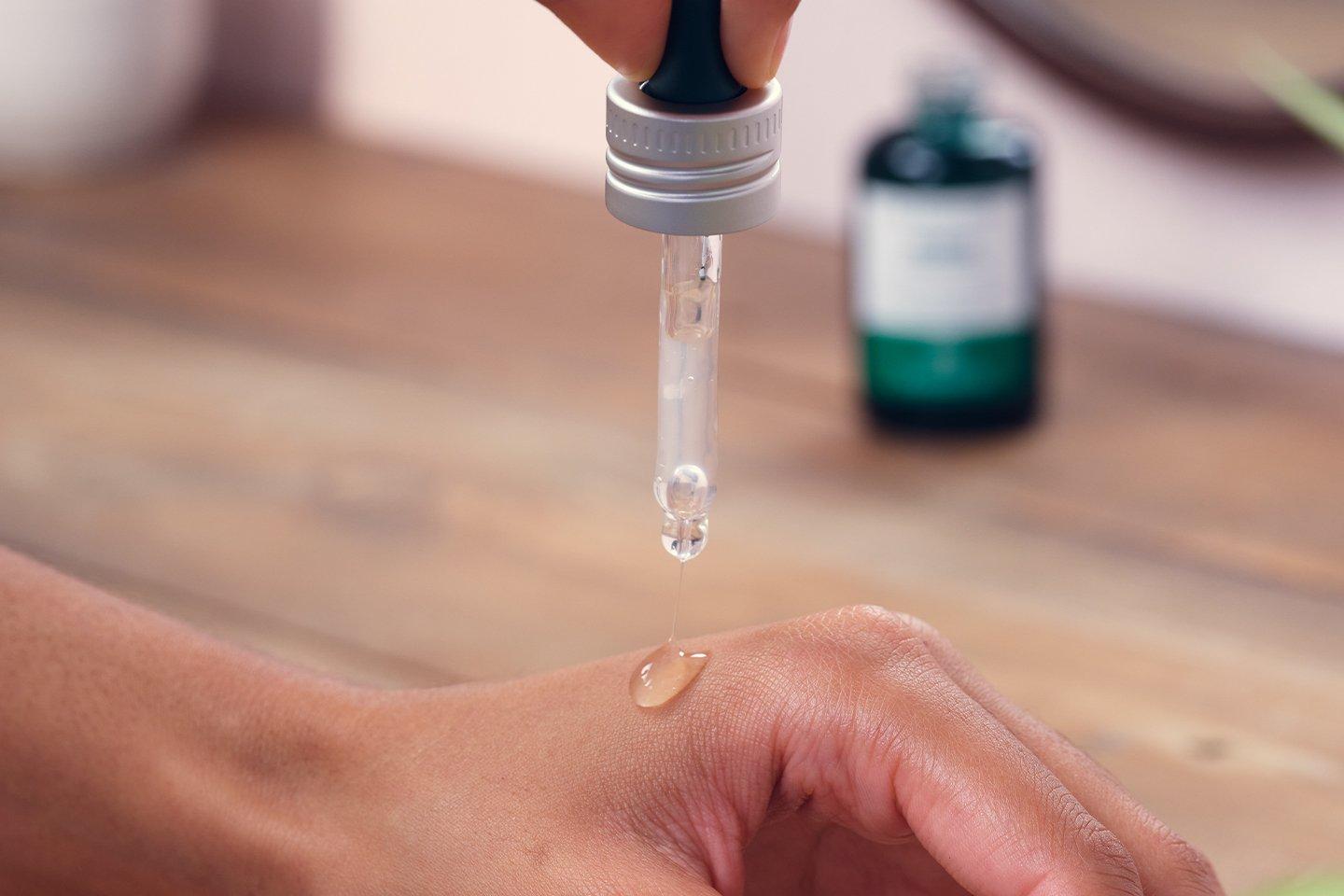 drop of serum on hand