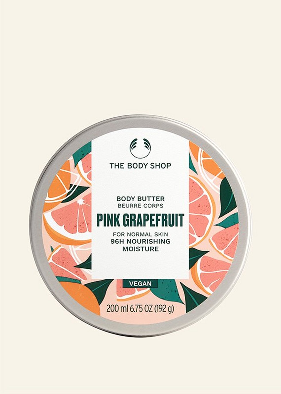 Pink grapefruit body butter against beige background Pink grapefruit body butter against beige background