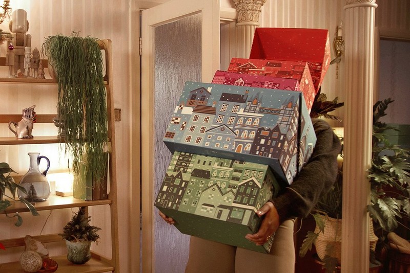 Person holding advent calendars Person holding advent calendars