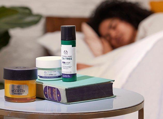 Woman sleeping with favourite night time products