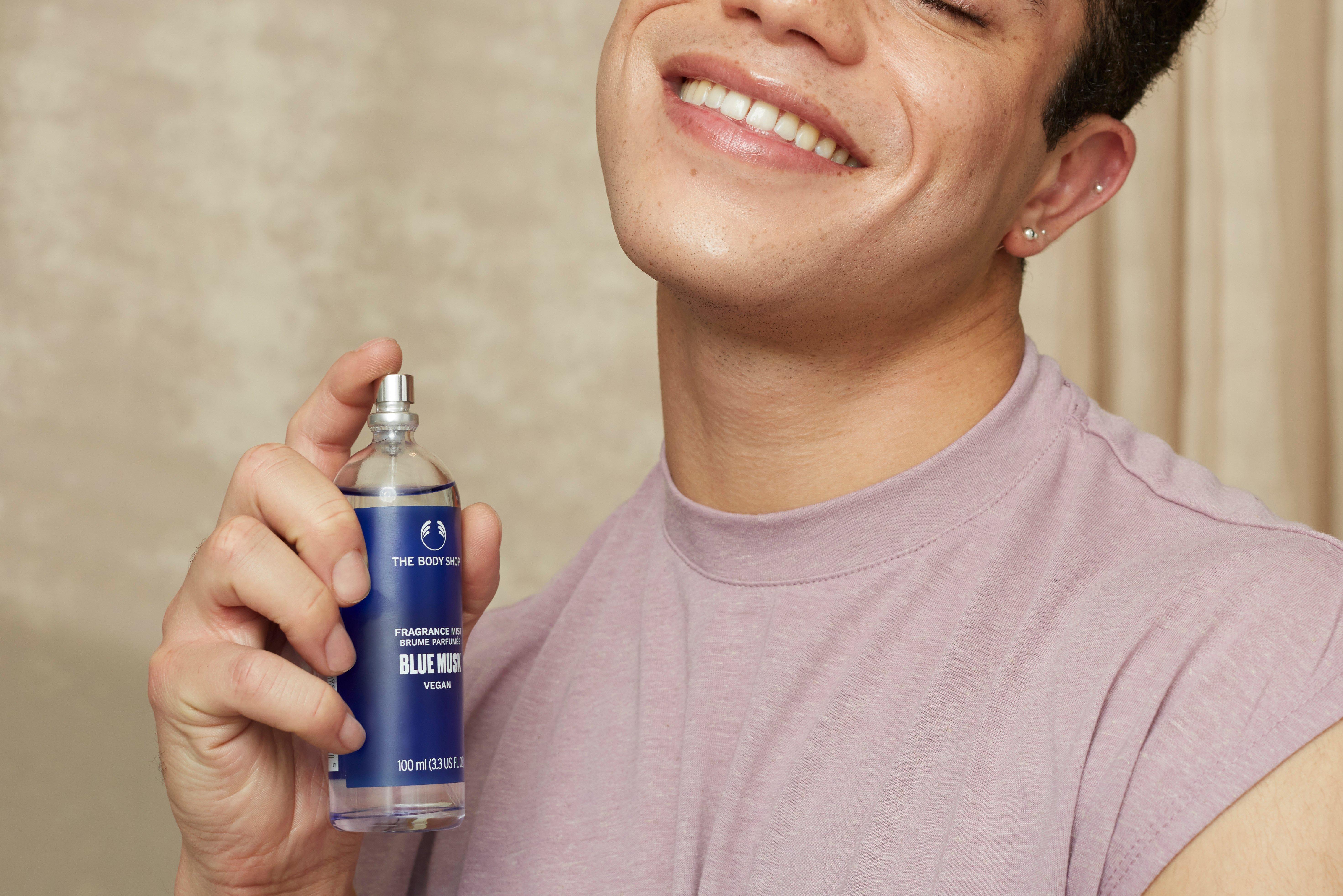 Man applying White Musk Fragrance Eau De Toilette