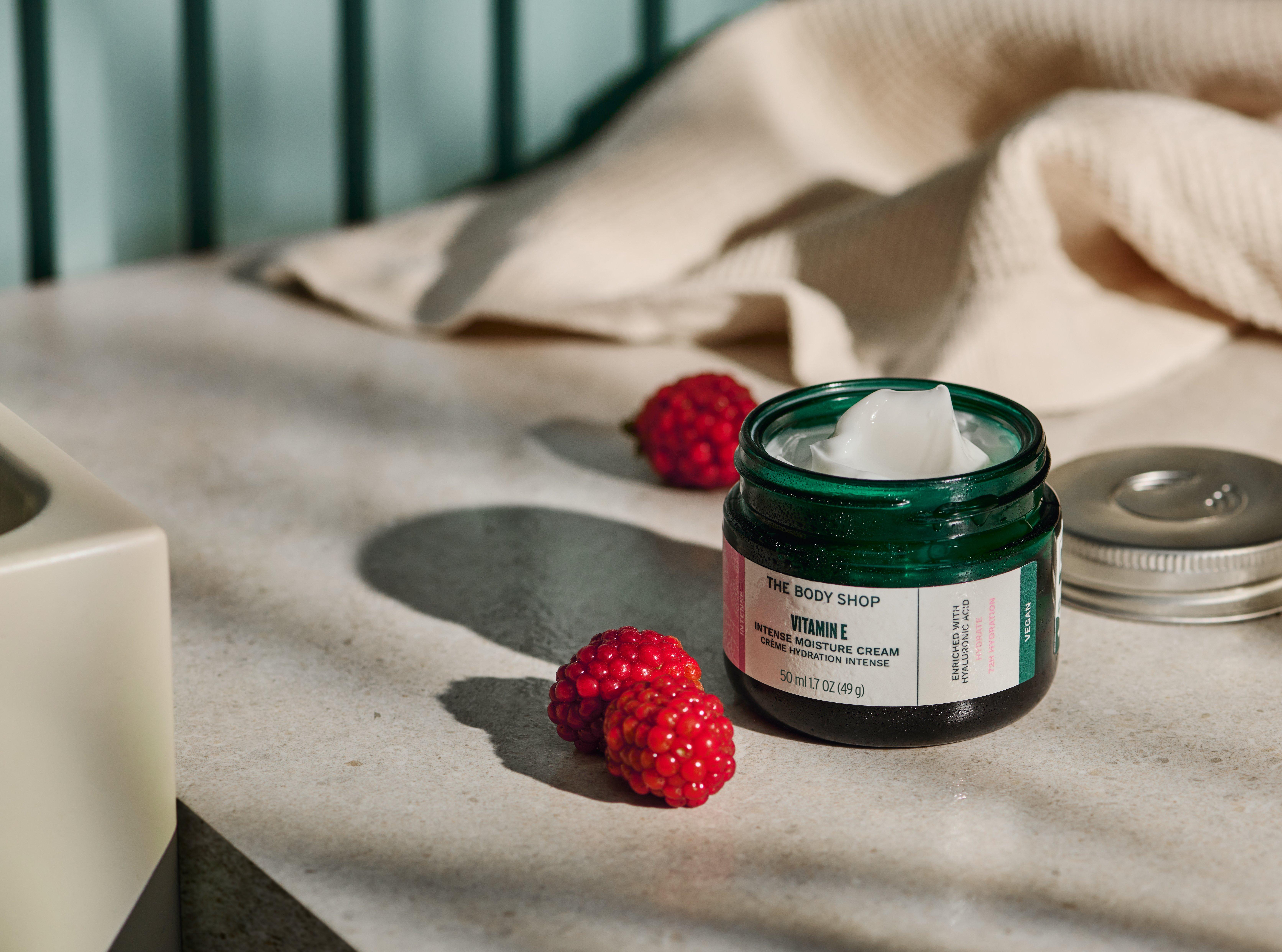 Hands using The Body Shop Vitamin E Moisture Cream