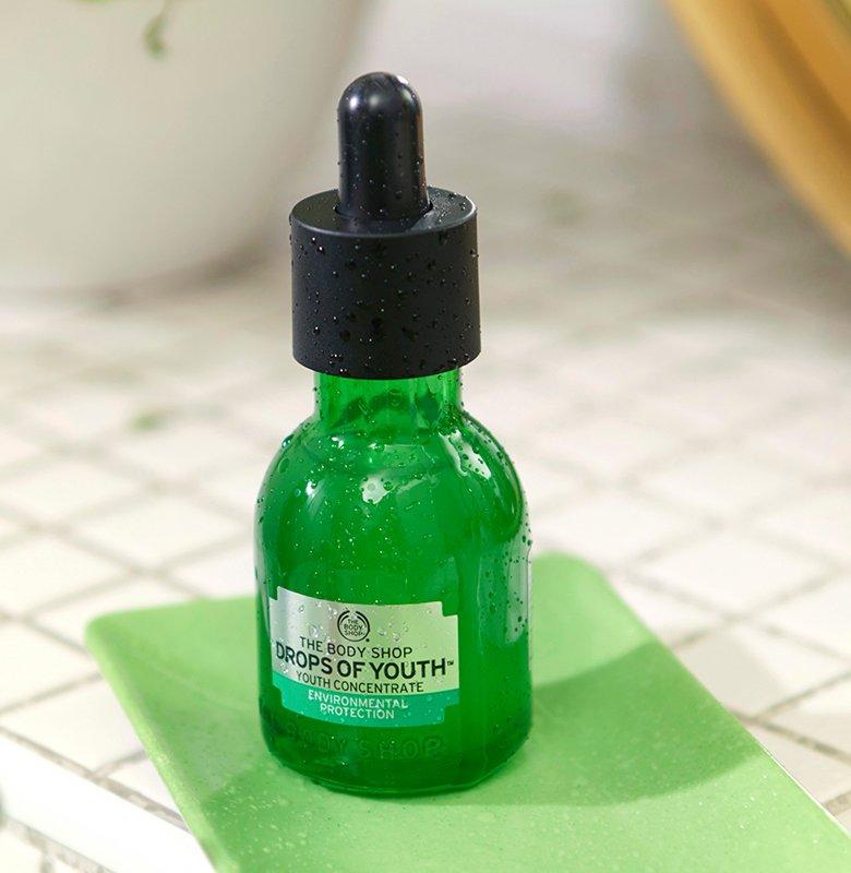 Drops of Youth Concentrate on white tile surface