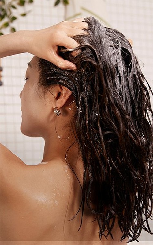 Woman washing her hair Woman washing her hair