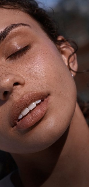 Close up shot of model with freckles Close up shot of model with freckles