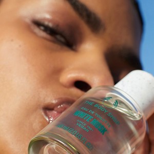 Woman holding The Body Shop White Musk Eau de Parfum Woman holding The Body Shop White Musk Eau de Parfum