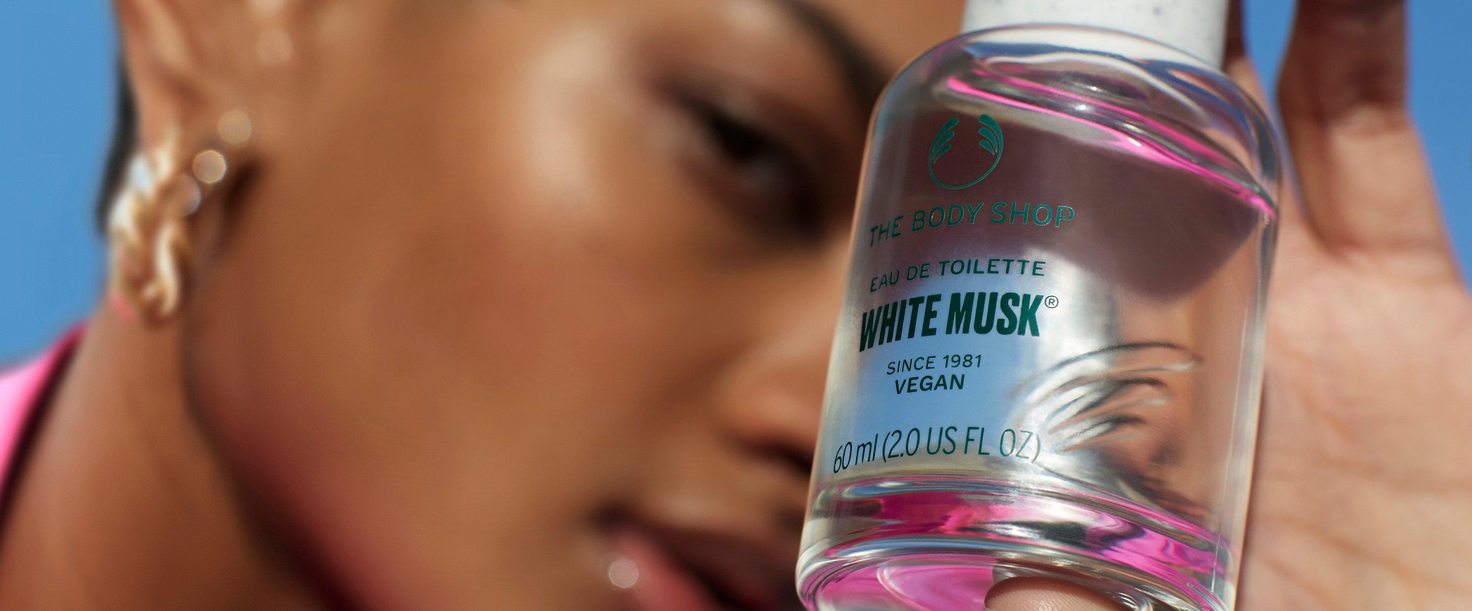 Woman holding The Body Shop White Musk Eau De Toilette