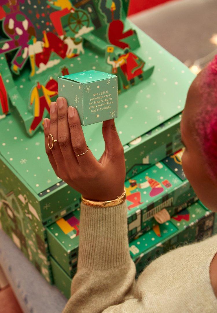 Person opening advent calendar