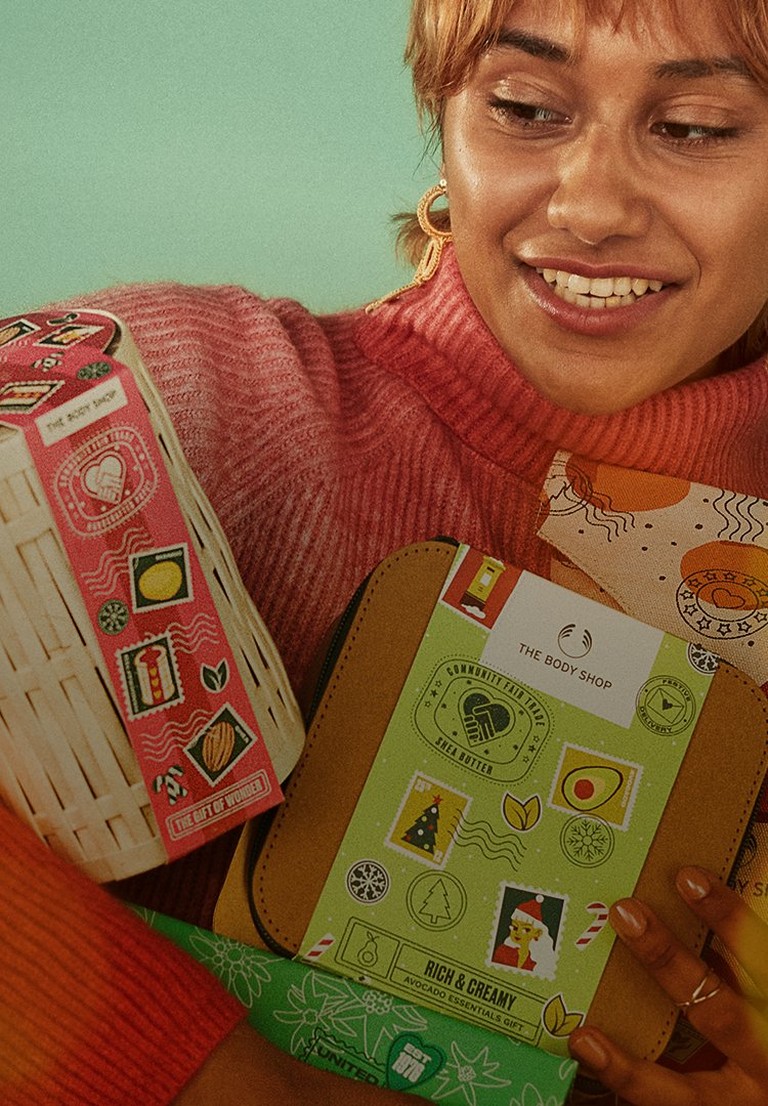 Image of woman holding Christmas gifts