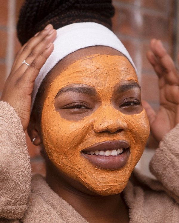 Woman using Vanilla Pumpkin face mask Woman using Vanilla Pumpkin face mask