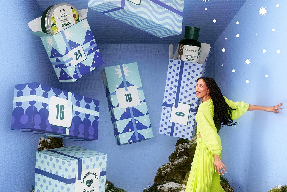 girl looking inside advent calendar