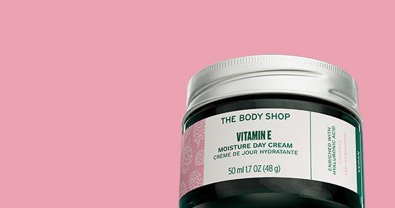 The body shop vitamin e cream 15 percent off on a pink background