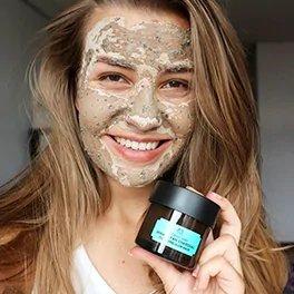 Lady With Face Mask Holding Himalayan Charcoal Purifying Clow Mask Pot