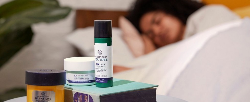 The body shop night cream on bedside table The body shop night cream on bedside table