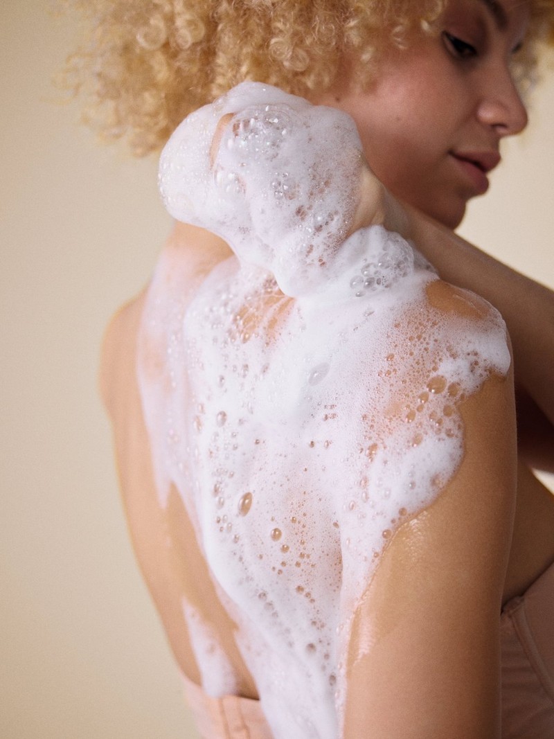 Woman using foaming wash Woman using foaming wash