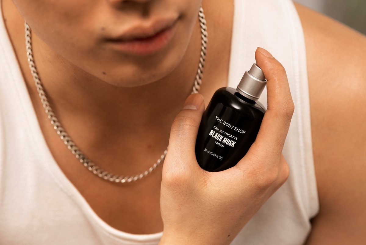 Person applying The Body Shop Black Musk Product