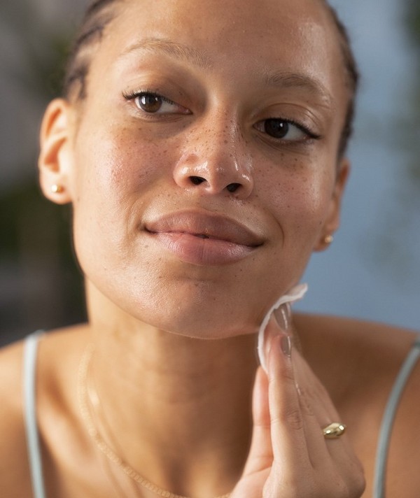 Woman cleansing skin Woman cleansing skin