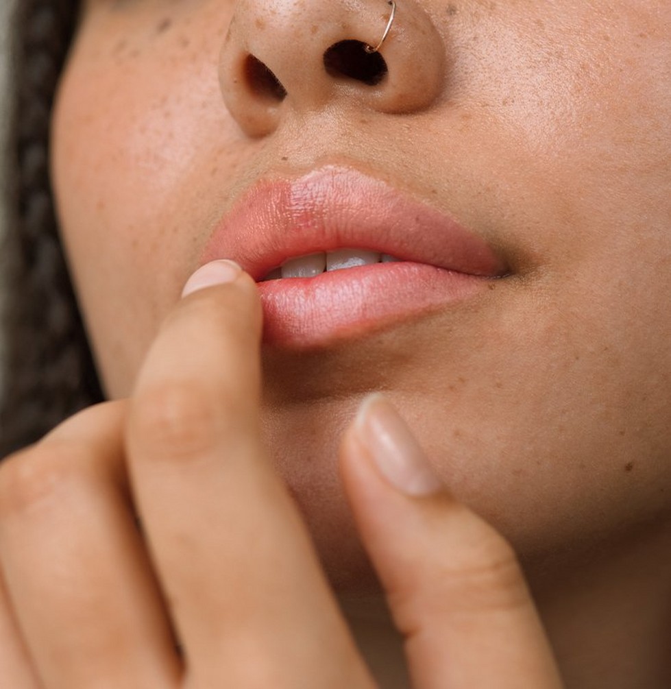 Person applying lip balm Person applying lip balm