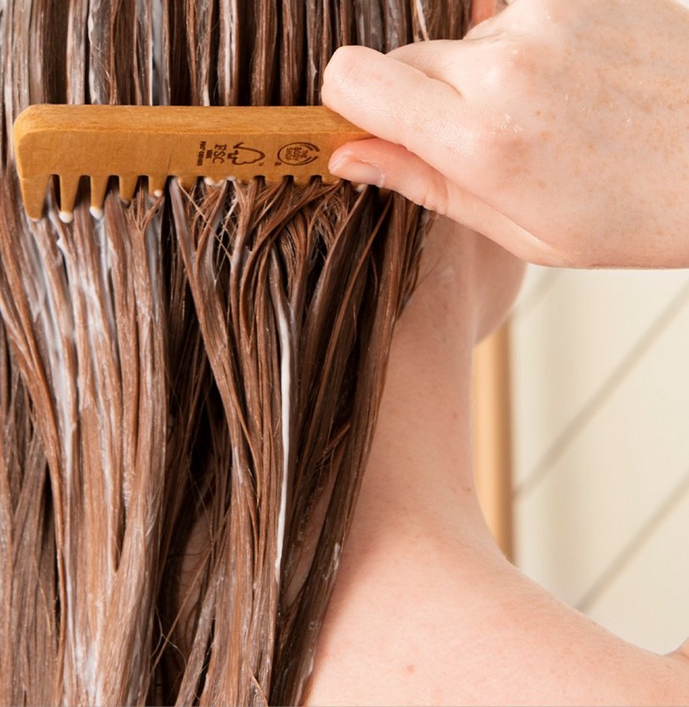 Person combing hair Person combing hair