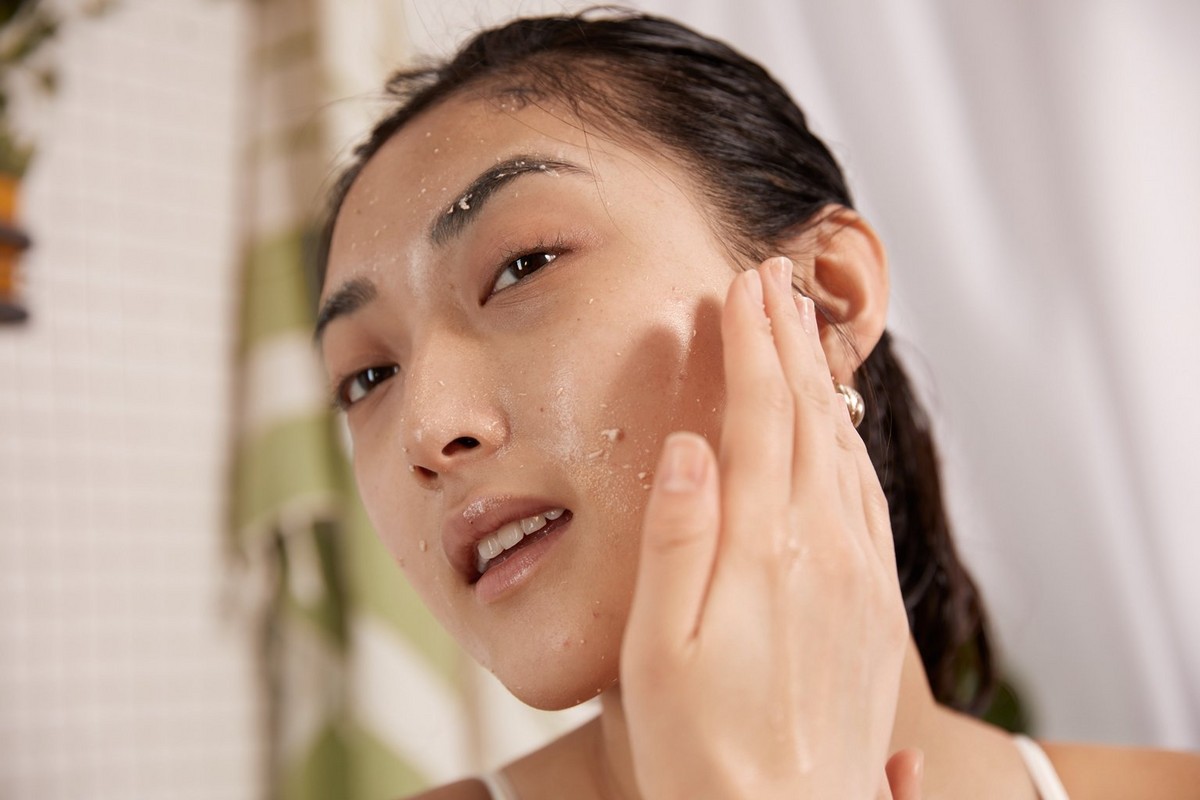Woman applying face peel