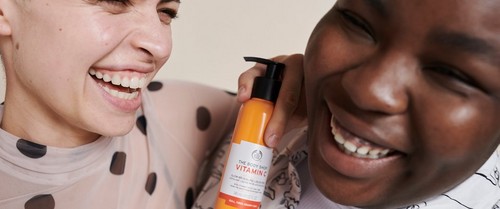 Models smiling with Vitamin C product Models smiling with Vitamin C product
