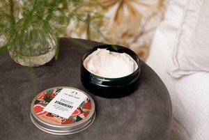 The Body Shop Strawberry Body Butter on side table The Body Shop Strawberry Body Butter on side table