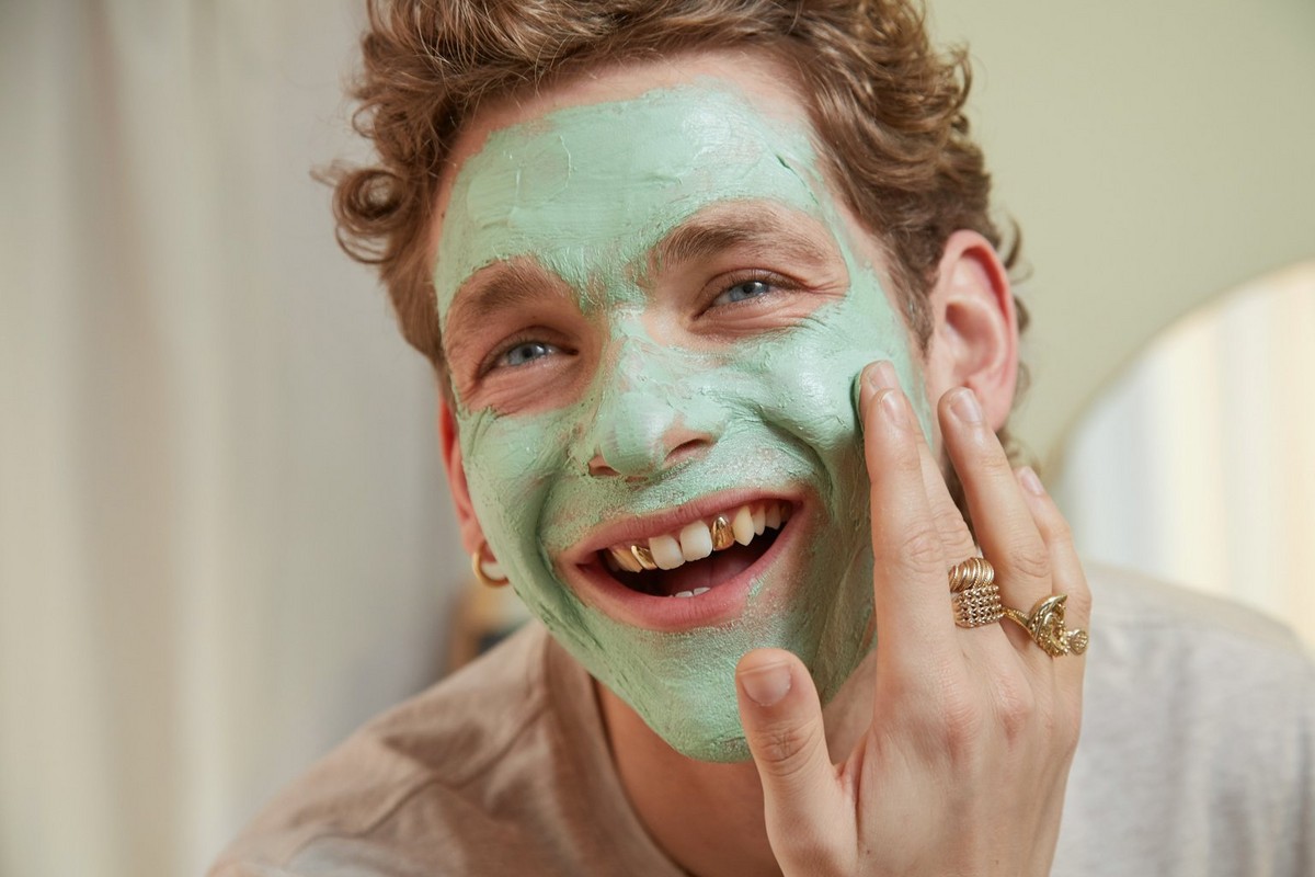 man applying a face mask