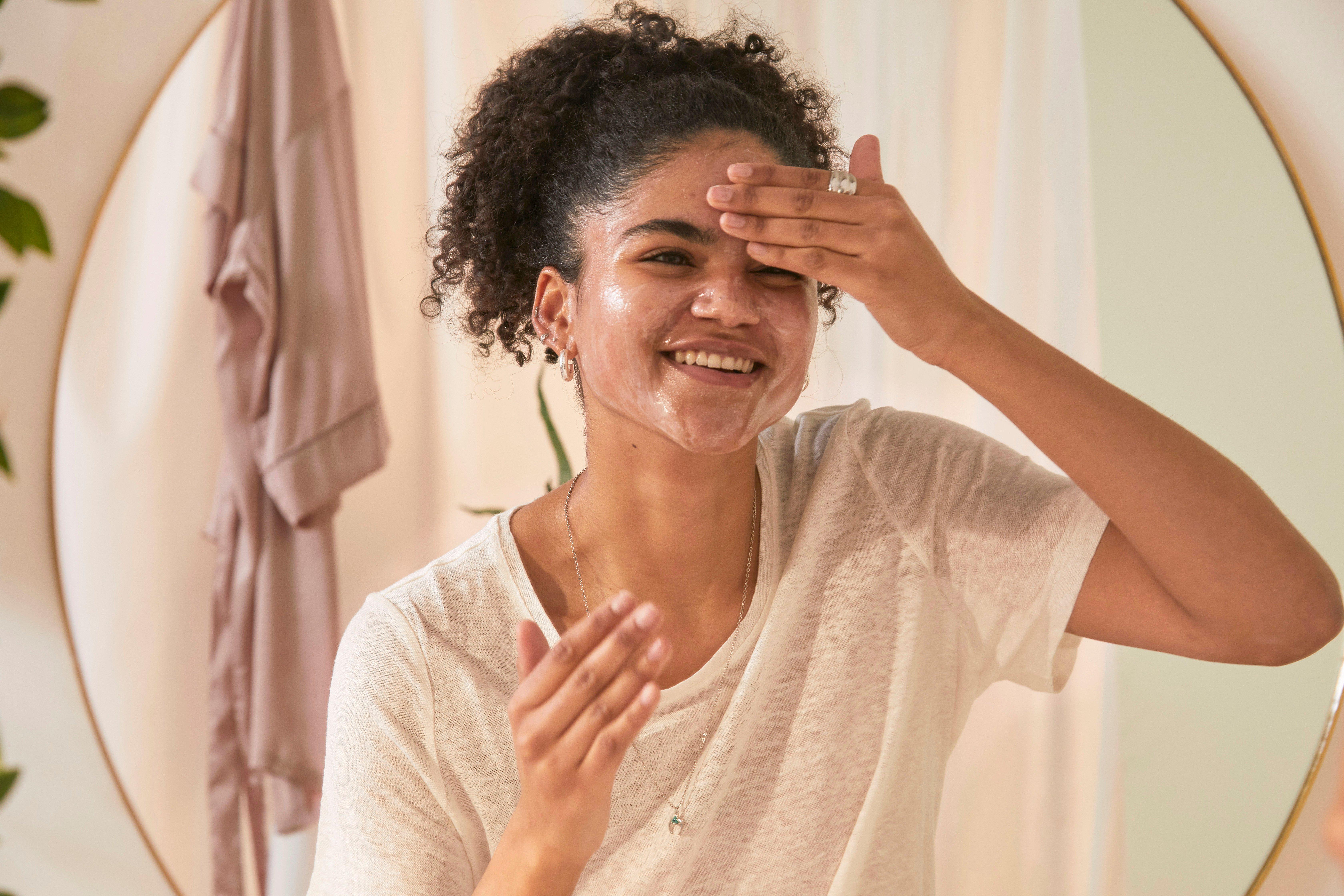 Woman applying a face wash