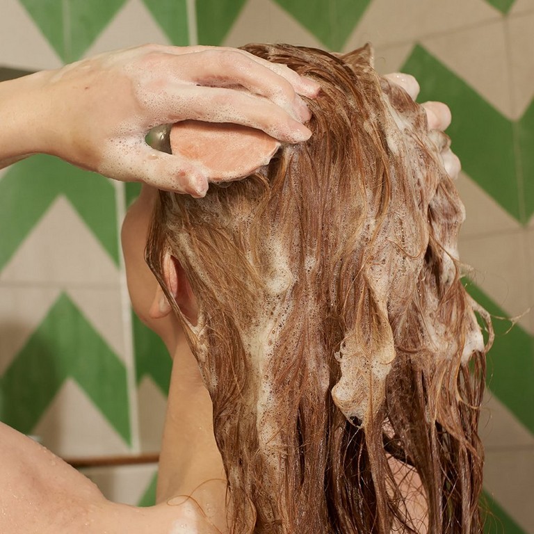 Model combing hair