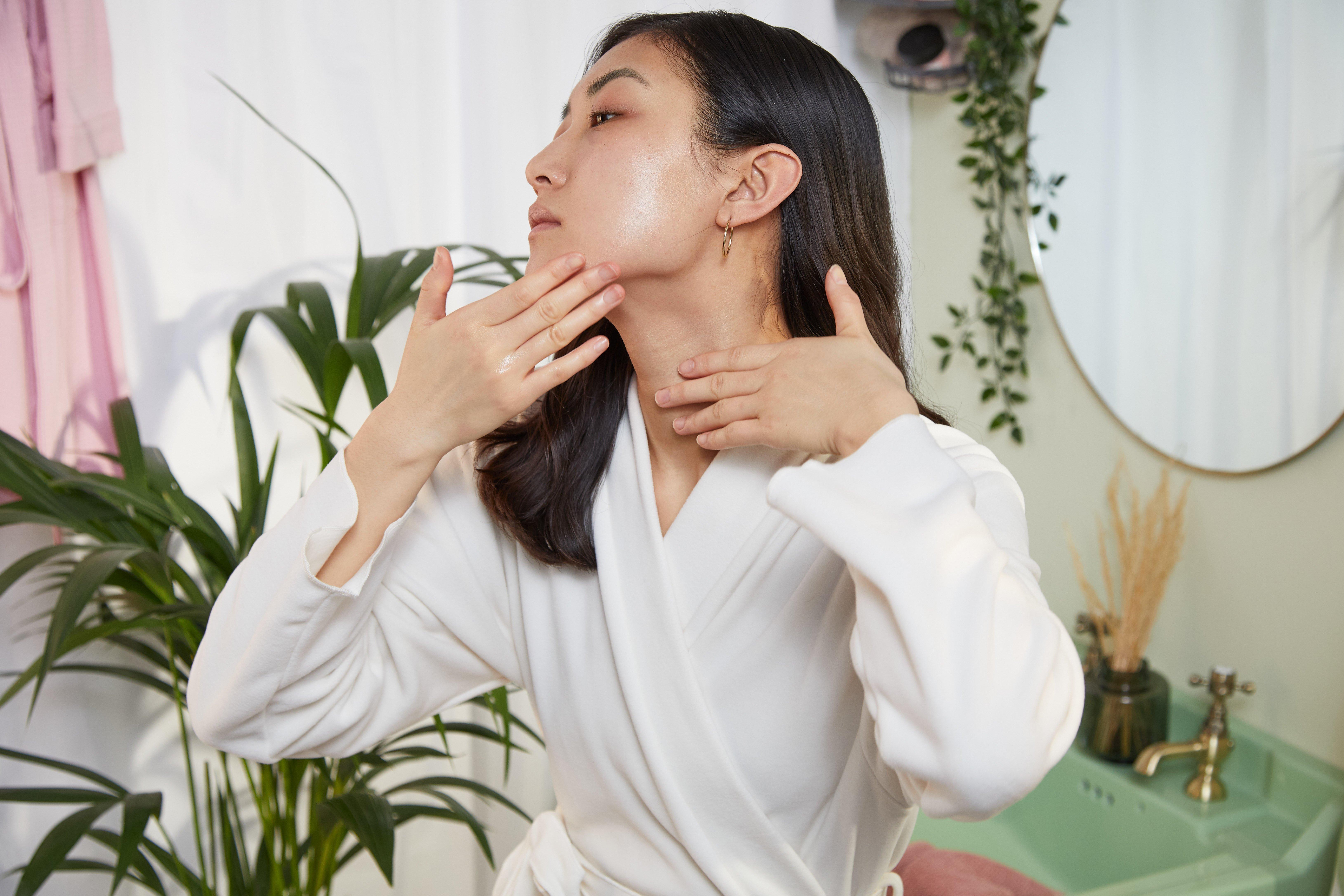 Woman applying overnight serum