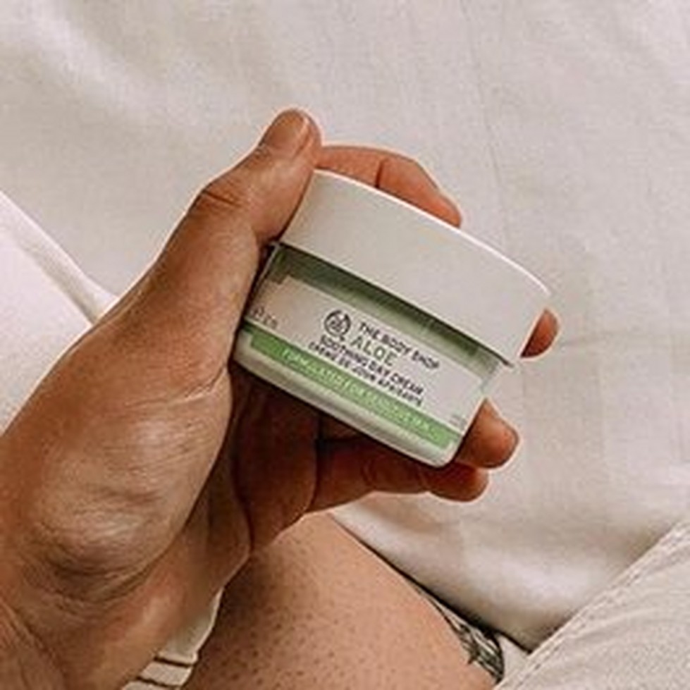 Hand Holding Aloe Soothing Day Cream Hand Holding Aloe Soothing Day Cream
