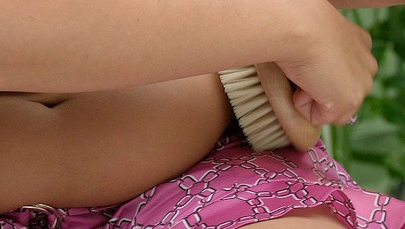 Using body brush on arm Using body brush on arm