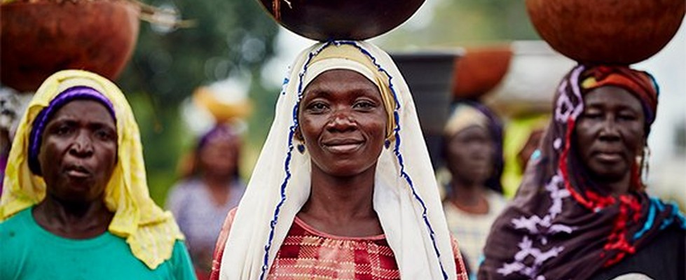three women with bowls carried on their heads three women with bowls carried on their heads