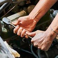 Hands working on an engine